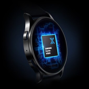 Close-up of a smartwatch screen powered by Samsung Exynos W1000 chip with a blue circuit background.
